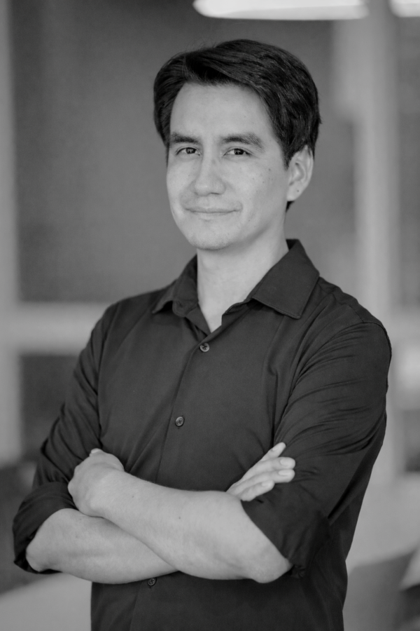 Black-and-white professional portrait of neuroscientist and assistant professor Anthony Ariza